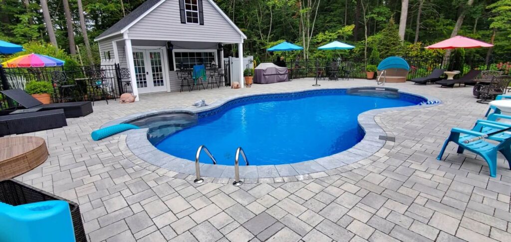 Inground pool with pavers surrounding it